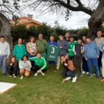 Álvaro Juan y Fabio con los participantes de la visita del Racing a la asociación Chamorro